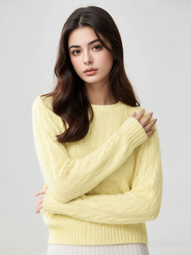 A woman wears a wool-cashmere light yellow sweater