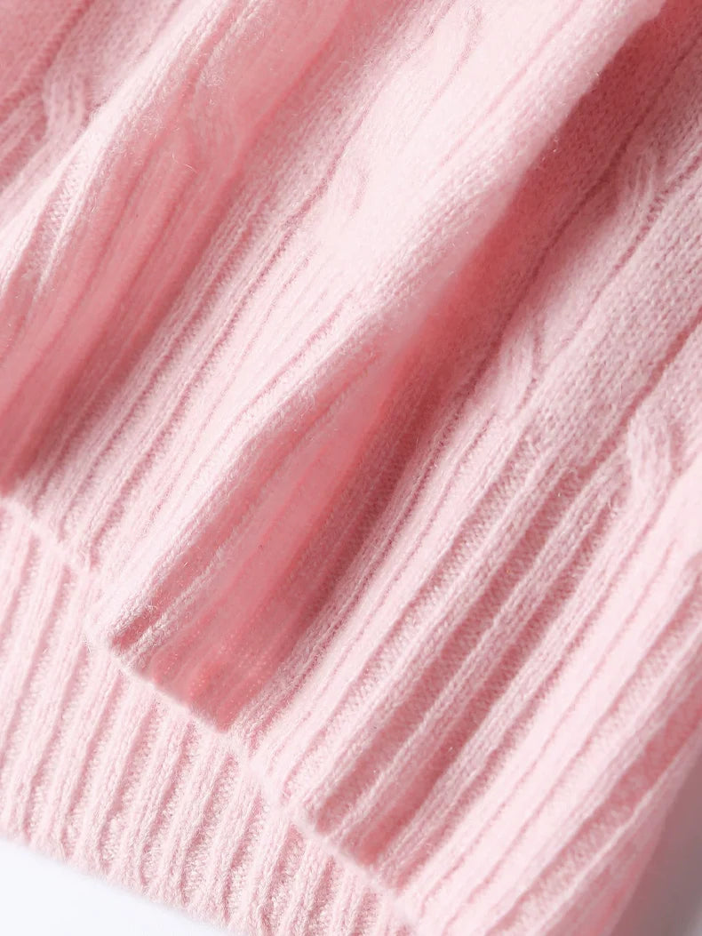 A wool-cashmere pink sweater hem close-up