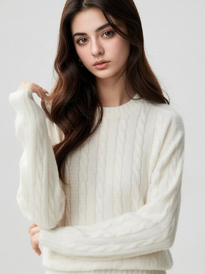 A woman wears a wool-cashmere ivory white sweater