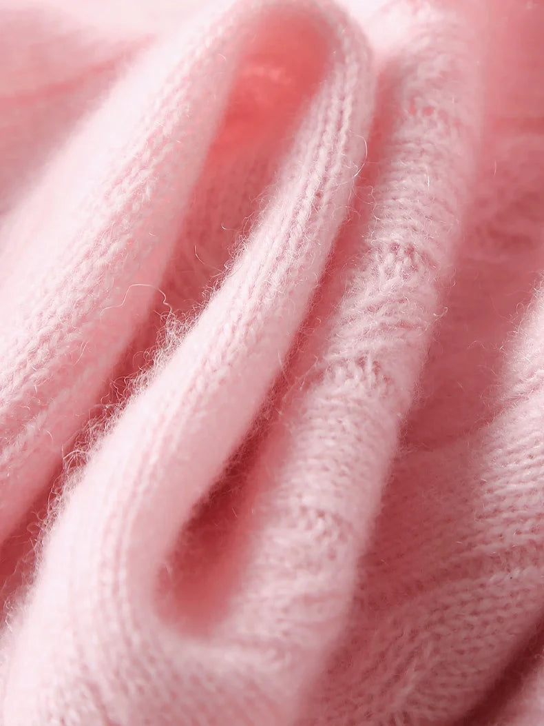 A wool-cashmere pink sweater  fabric trexture close-up