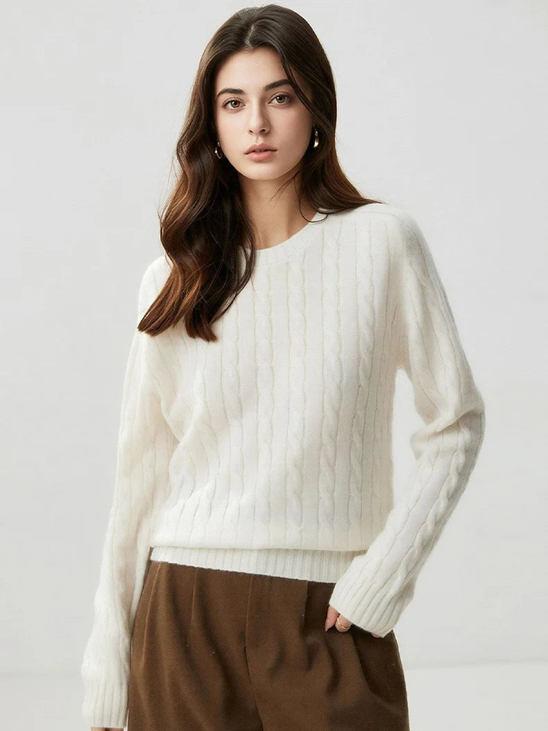 A woman wears a wool-cashmere ivory white sweater 
