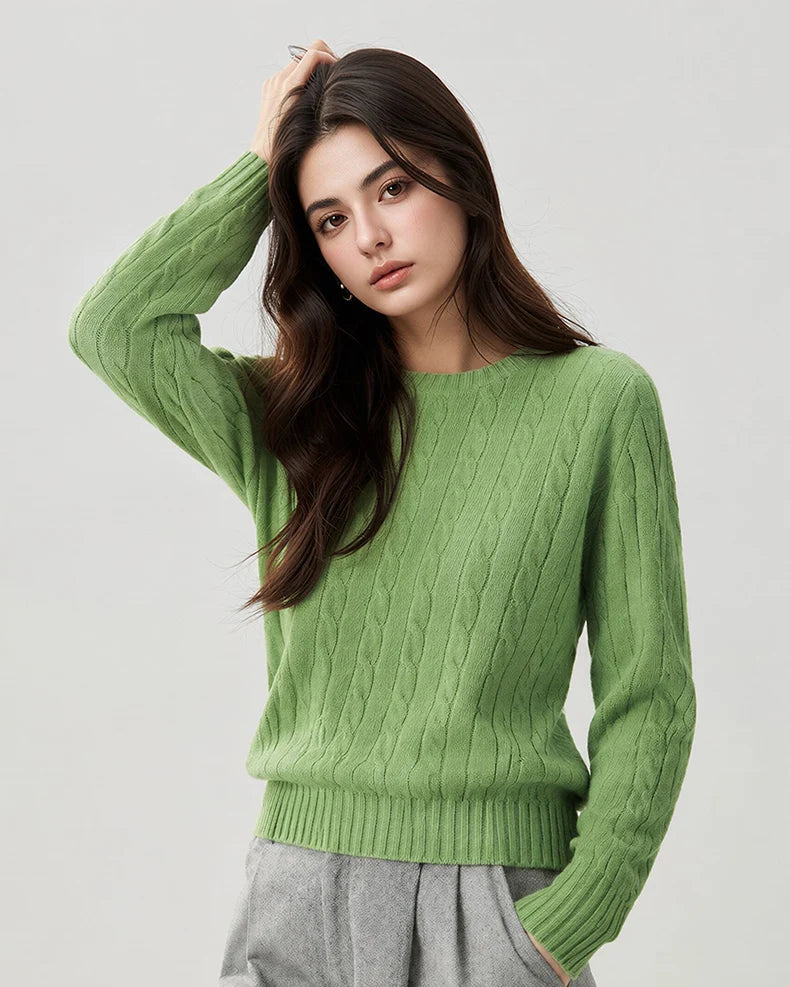 A woman wears a wool-cashmere light green sweater 