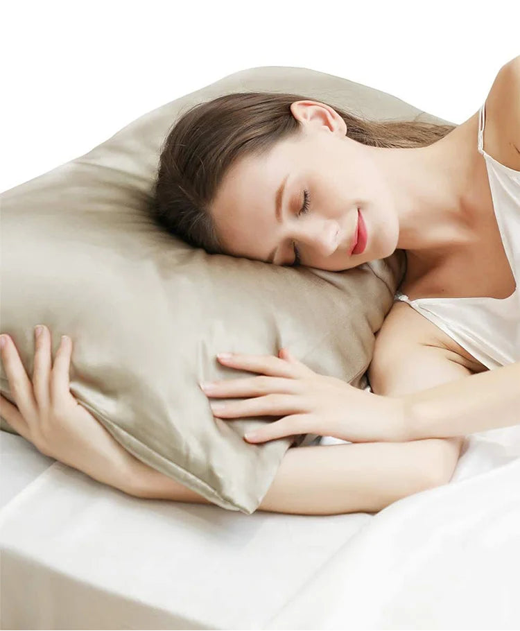 A woman sleeping on a pure mulberry silk beige pillowcase 