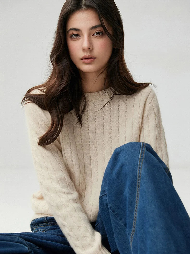 A woman wears a wool-cashmere beige sweater 