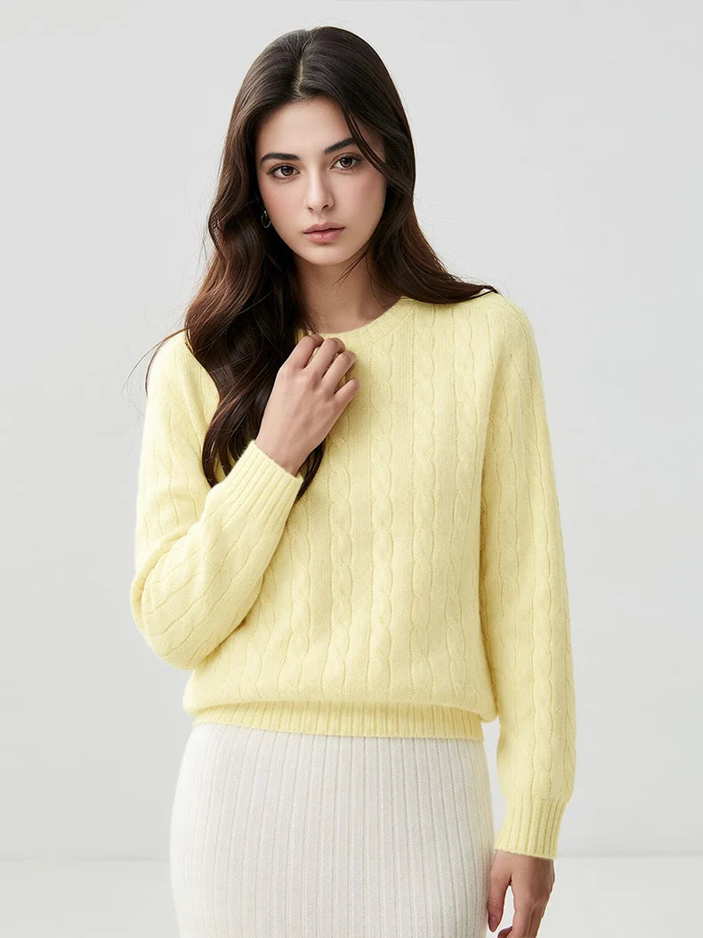 A woman wears a wool-cashmere light yellow sweater 
